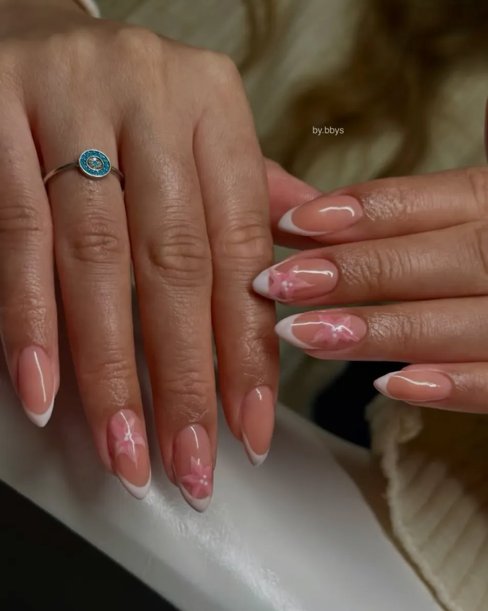 White French tips with pink flowers by BY BBYS, lash and nail studio in Kelham Island, Sheffield