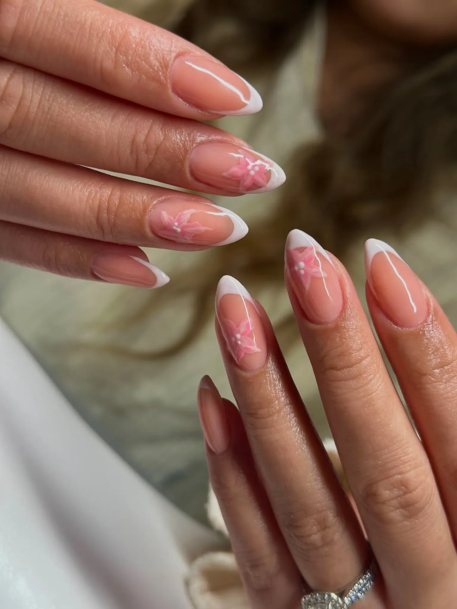 Almond nails with white tips and pink flowers by BY BBYS, lash and nail studio in Kelham Island, Sheffield